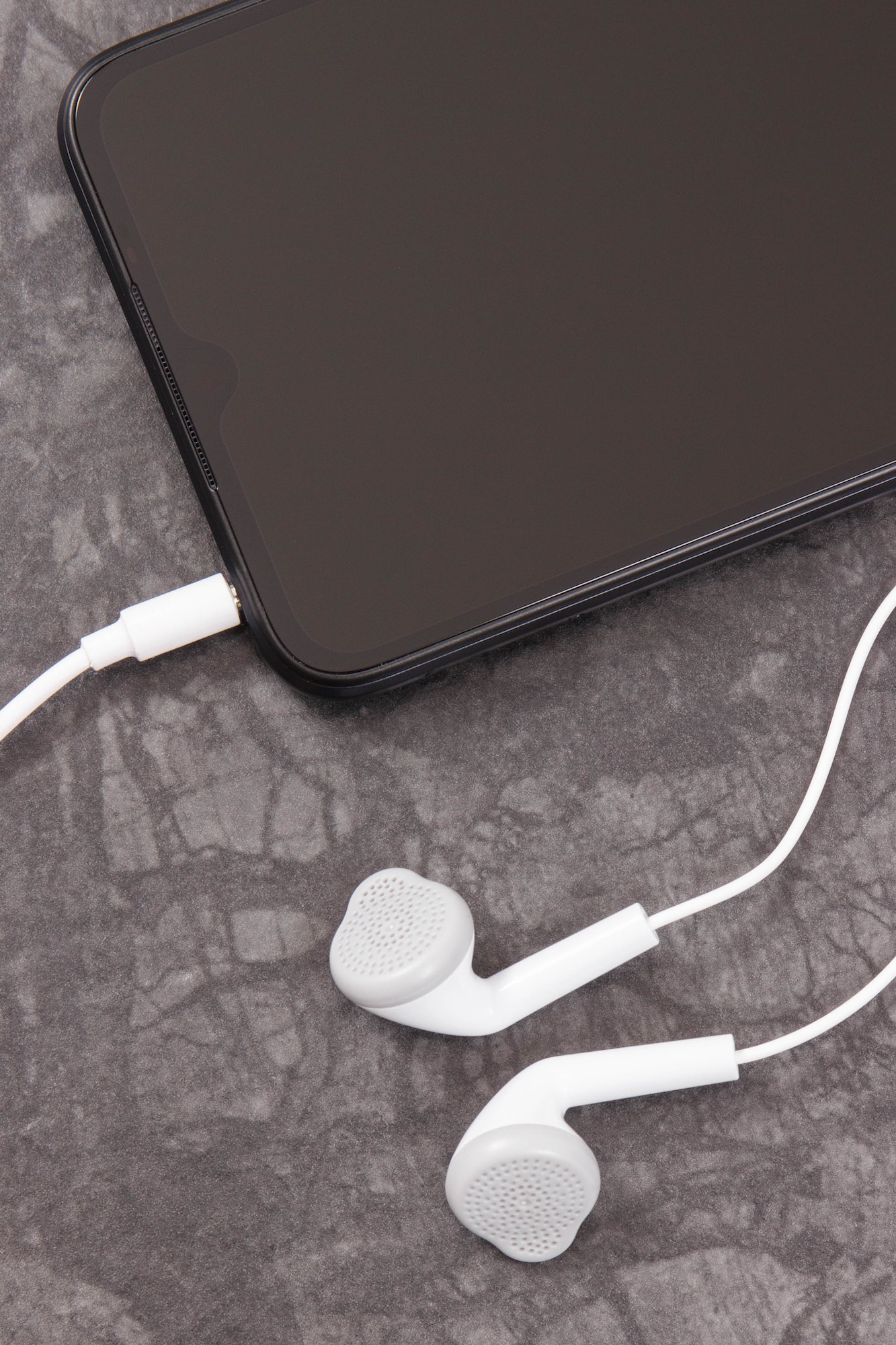 Mobile phone, smartphone with connected headphones. Electronics equipment